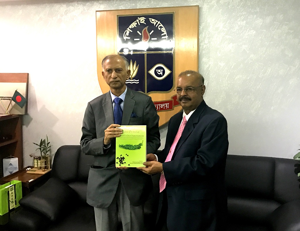 Dr. Muhammed Majeed presents BioPerine® book to Dr. AAMS Arefin Siddique, Vice Chancellor of Dhaka University